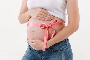 cropped-image-of-pregnant-woman-presents-a-gift.jpg